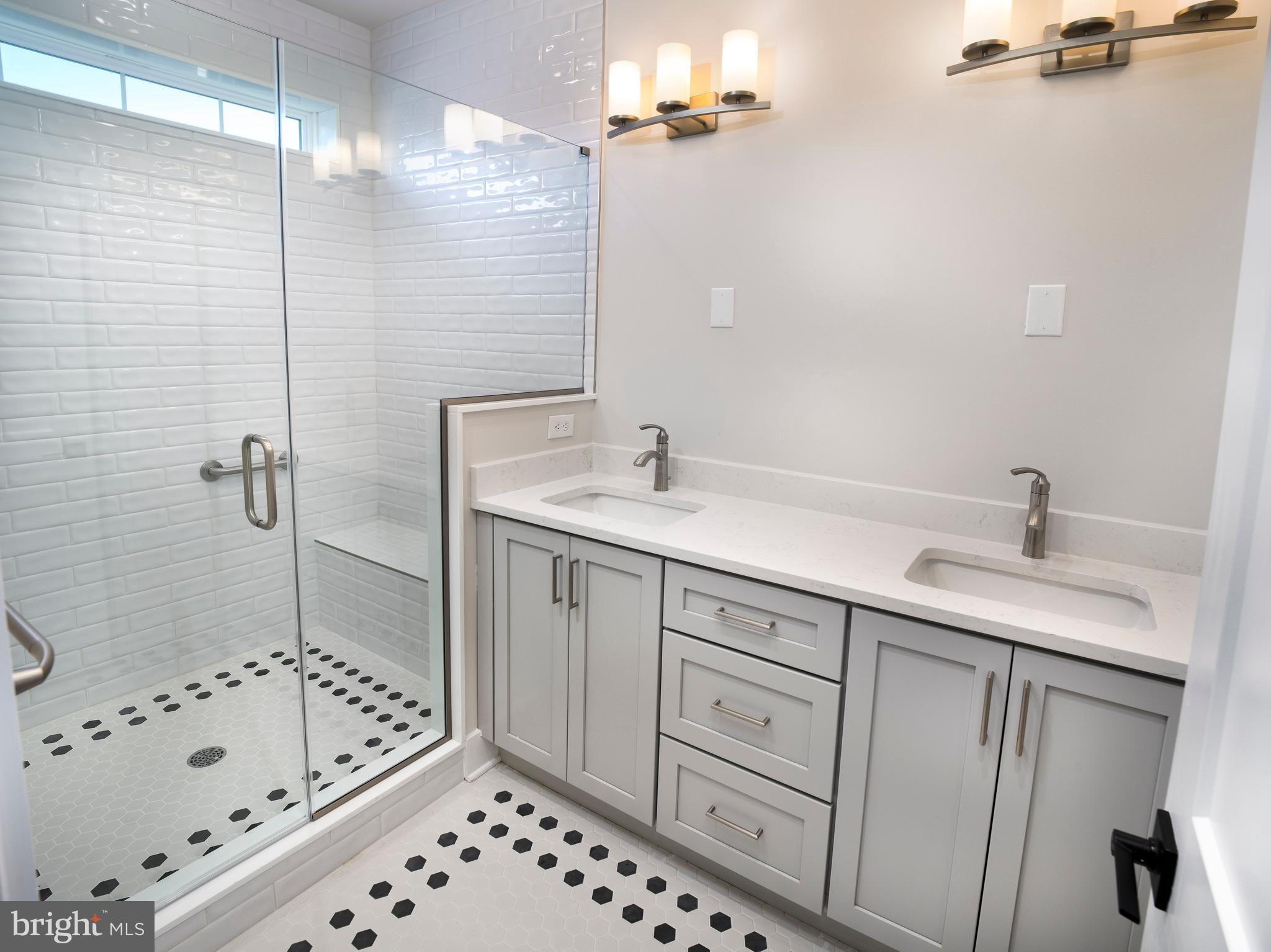 354 Paddock Circle Newtown Square, PA 19073 - Photo 18 of 36 a bathroom with a sink a toilet and shower