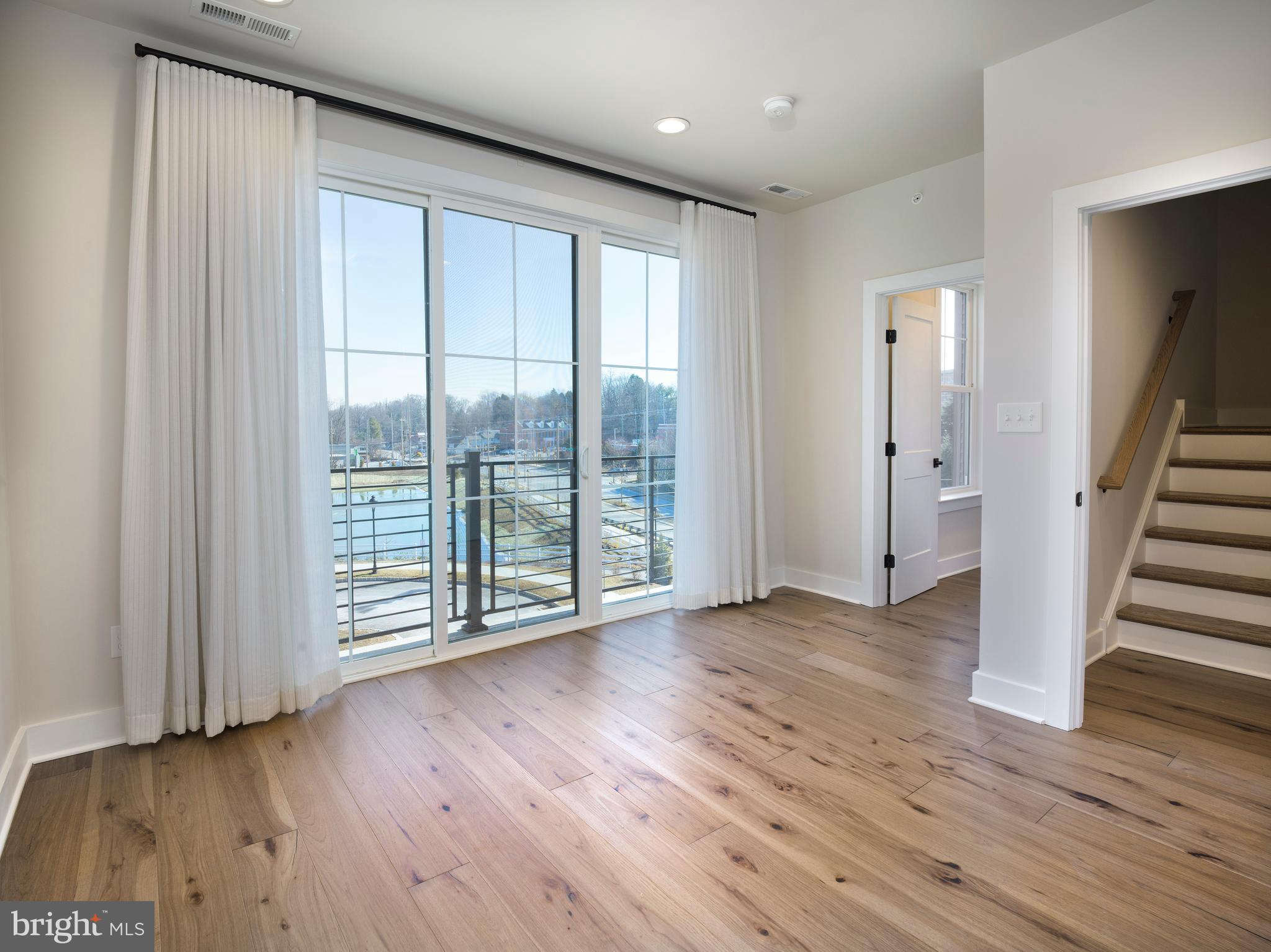 354 Paddock Circle Newtown Square, PA 19073 - Photo 21 of 36 a view of wooden floor and windows in a room