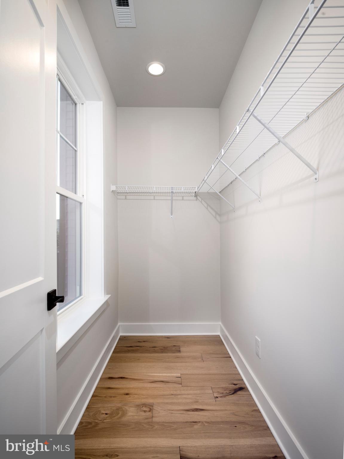 354 Paddock Circle Newtown Square, PA 19073 - Photo 23 of 36 a view of a room with wooden floor and white walls