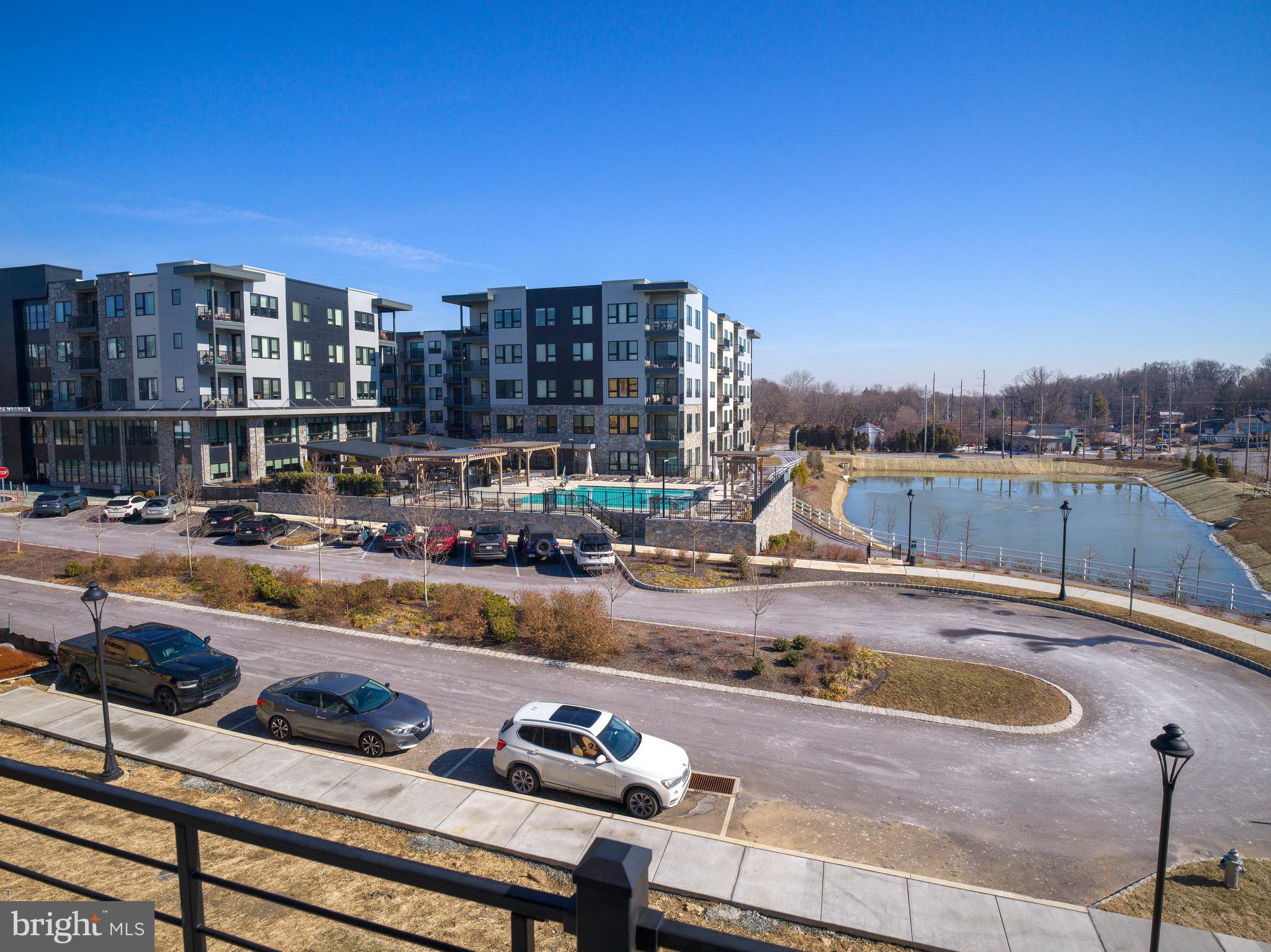 354 Paddock Circle Newtown Square, PA 19073 - Photo 28 of 36 a view of a swimming pool with a lounge chairs