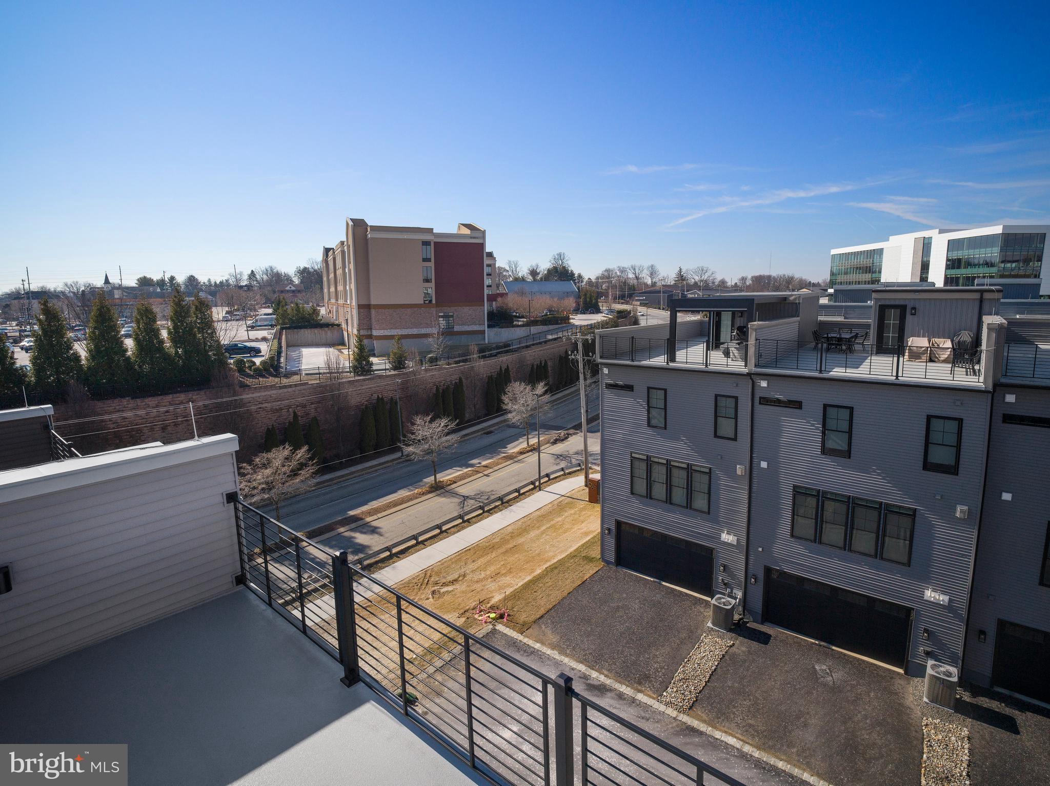 354 Paddock Circle Newtown Square, PA 19073 - Photo 30 of 36 a view of a city with tall buildings
