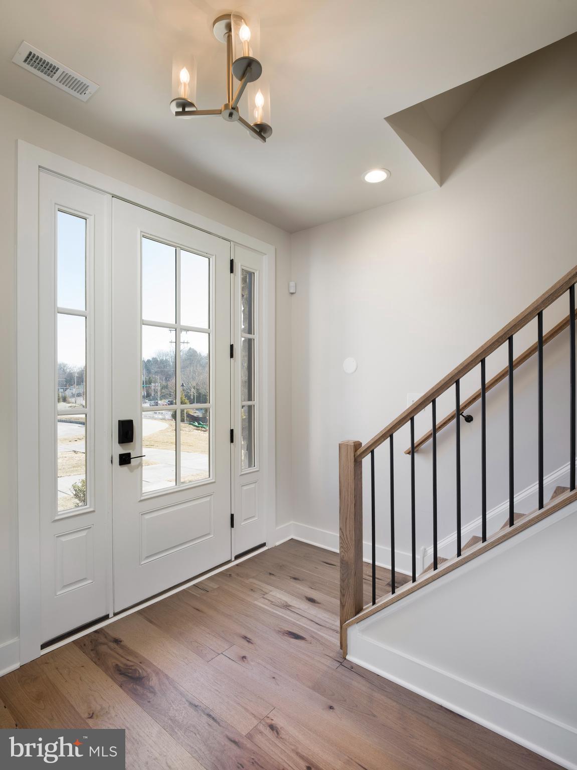 354 Paddock Circle Newtown Square, PA 19073 - Photo 3 of 36 a view of an empty room with wooden floor and a window
