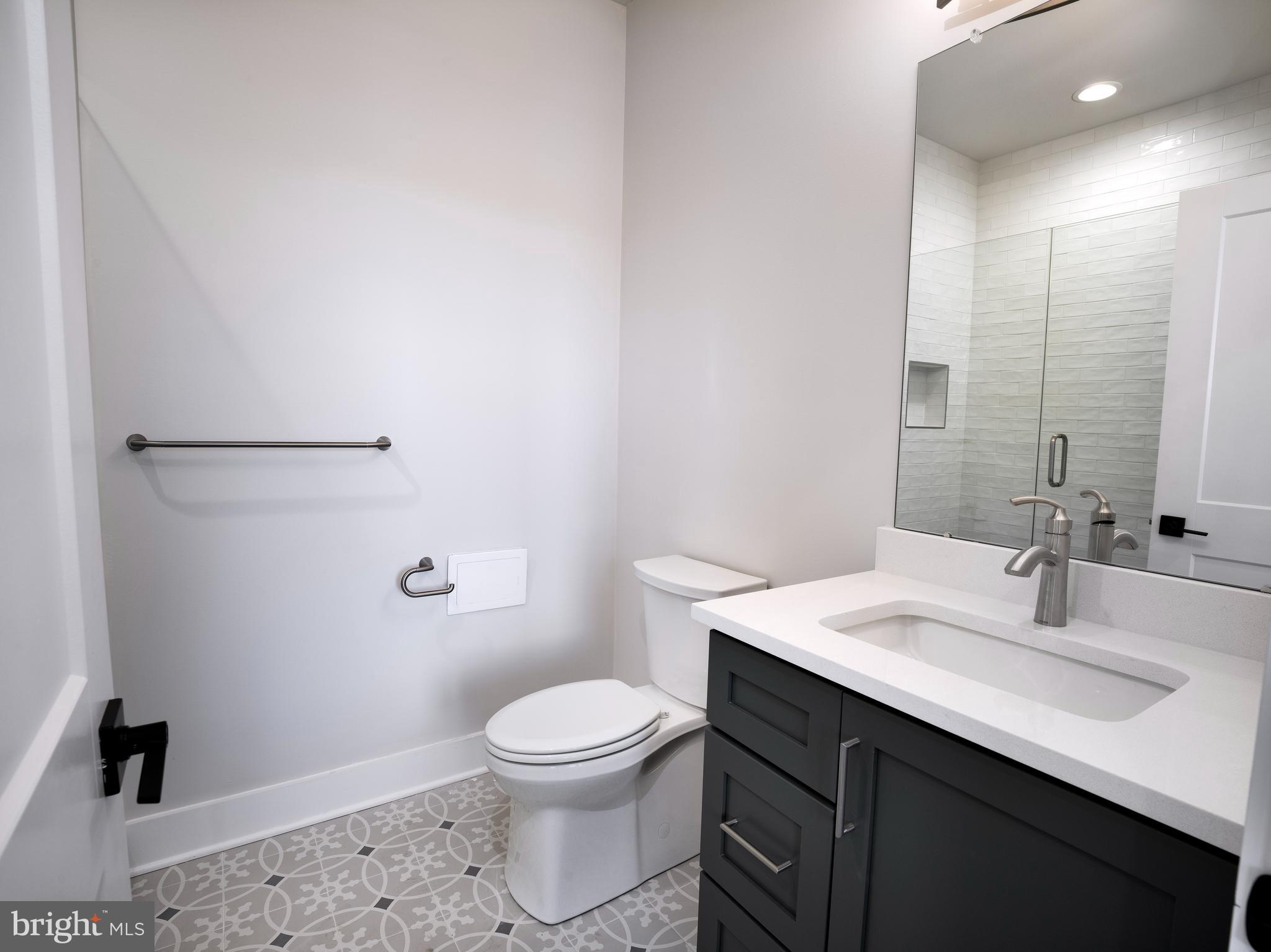 354 Paddock Circle Newtown Square, PA 19073 - Photo 5 of 36 a bathroom with a sink a toilet and vanity