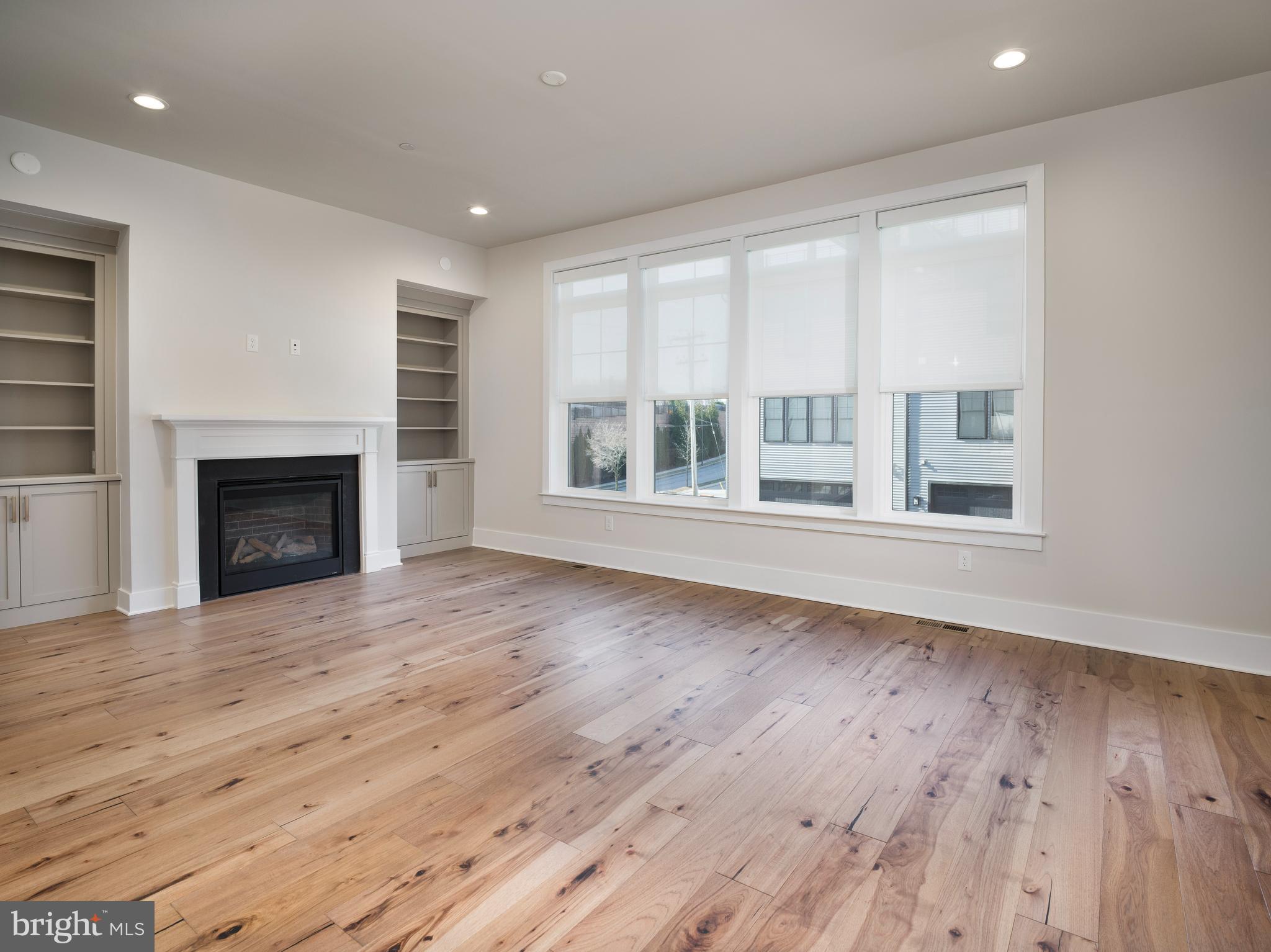 354 Paddock Circle Newtown Square, PA 19073 - Photo 7 of 36 a view of an empty room with wooden floor and a window
