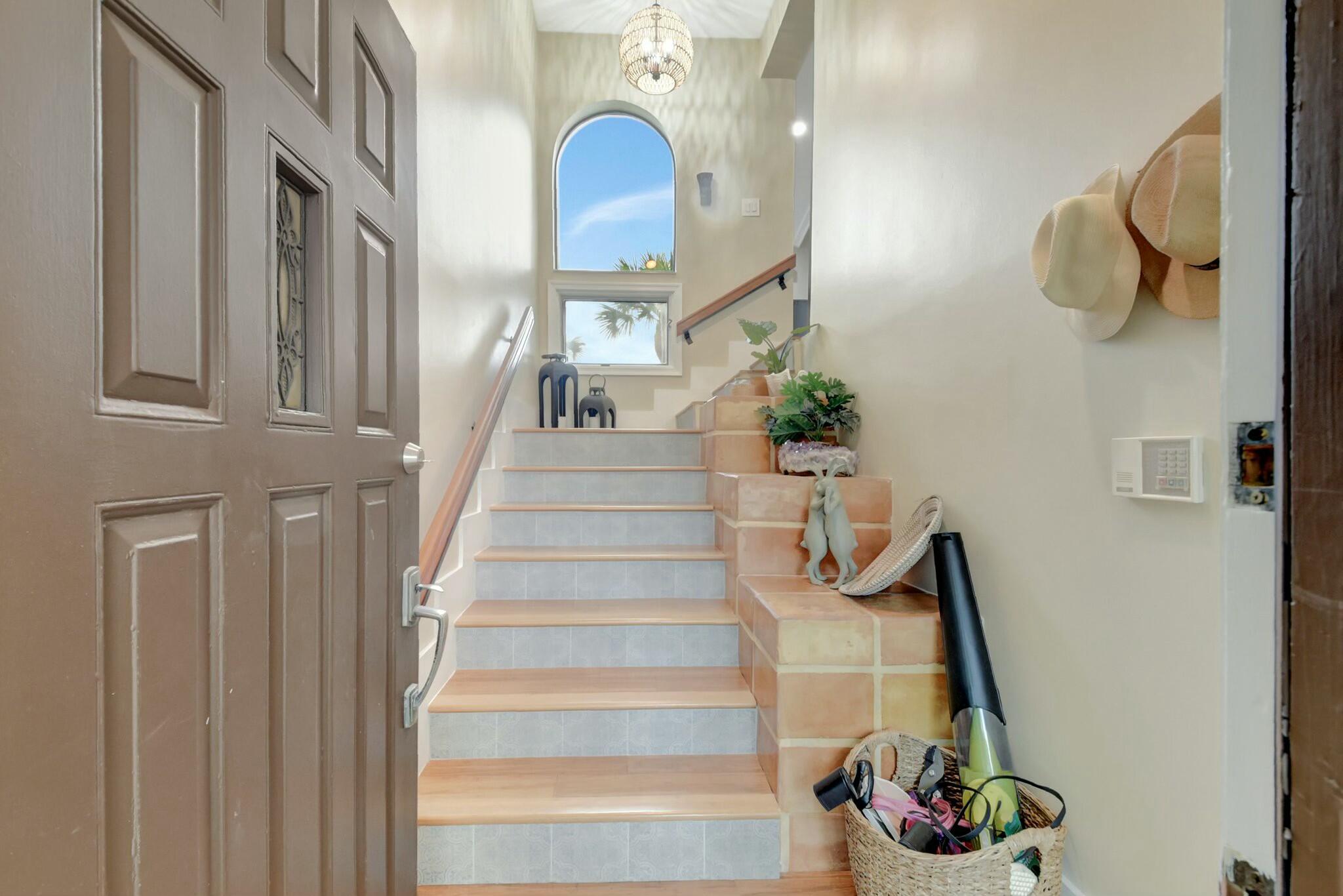 7860 Seville Place, Unit 2202 Boca Raton, FL 33433 - Photo 4 of 30 a view of staircase with white walls