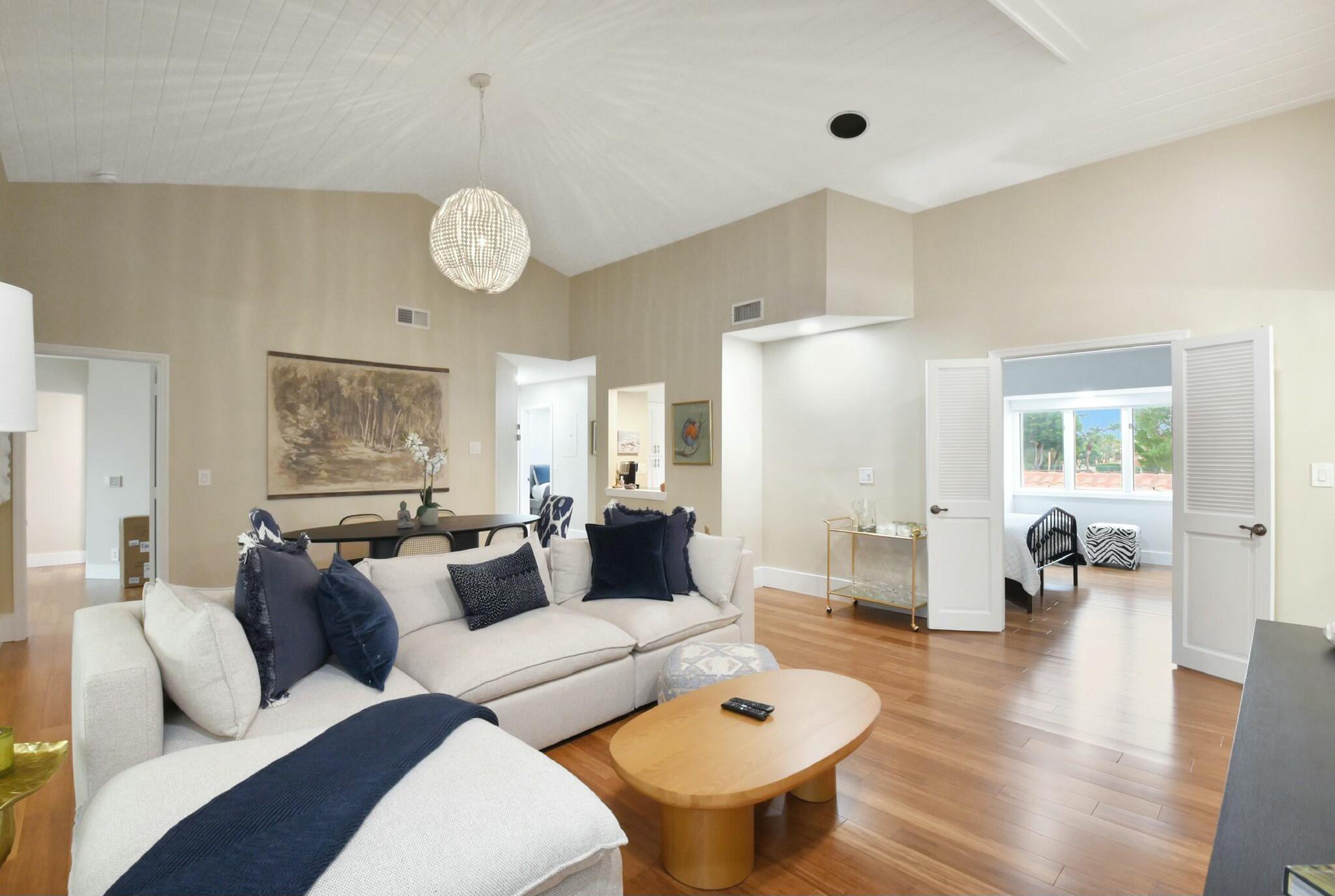 7860 Seville Place, Unit 2202 Boca Raton, FL 33433 - Photo 7 of 30 a living room with furniture kitchen view and a large window