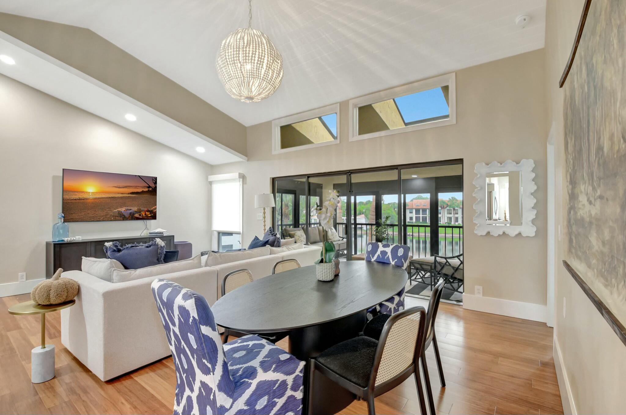 7860 Seville Place, Unit 2202 Boca Raton, FL 33433 - Photo 10 of 30 a view of a dining room with furniture window and outside view