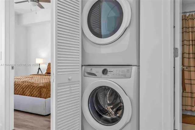 a city view from a balcony with furniture