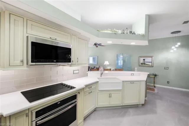 a kitchen with a stove and a microwave