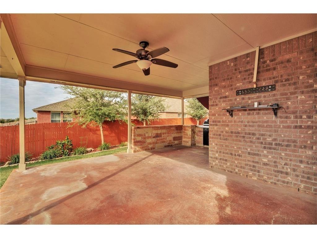 2109 Granite Springs Road Leander, TX 78641 - Photo 19 of 30 A spacious covered patio provides an ideal outdoor entertaining area with a built-in barbecue and brick accent walls.
