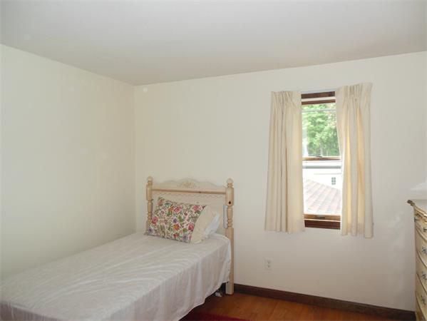 304 Edgewood Road West Springfield, MA 01089 - Photo 21 of 26 a bedroom with a bed and a window