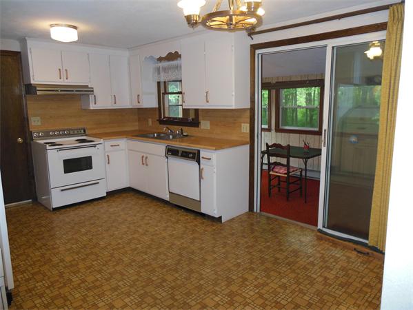 304 Edgewood Road West Springfield, MA 01089 - Photo 8 of 26 a kitchen with white cabinets and white appliances