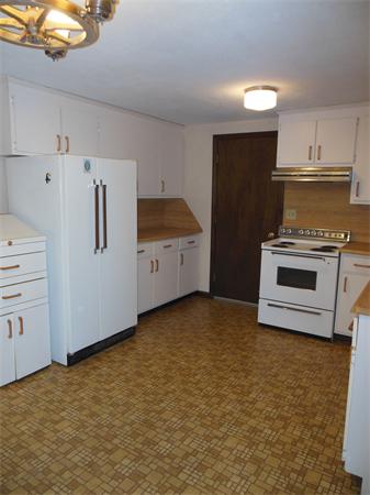 304 Edgewood Road West Springfield, MA 01089 - Photo 9 of 26 a kitchen with stainless steel appliances a stove and a refrigerator