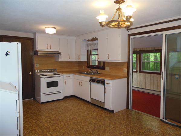 304 Edgewood Road West Springfield, MA 01089 - Photo 10 of 26 a kitchen with granite countertop a stove a sink and a refrigerator