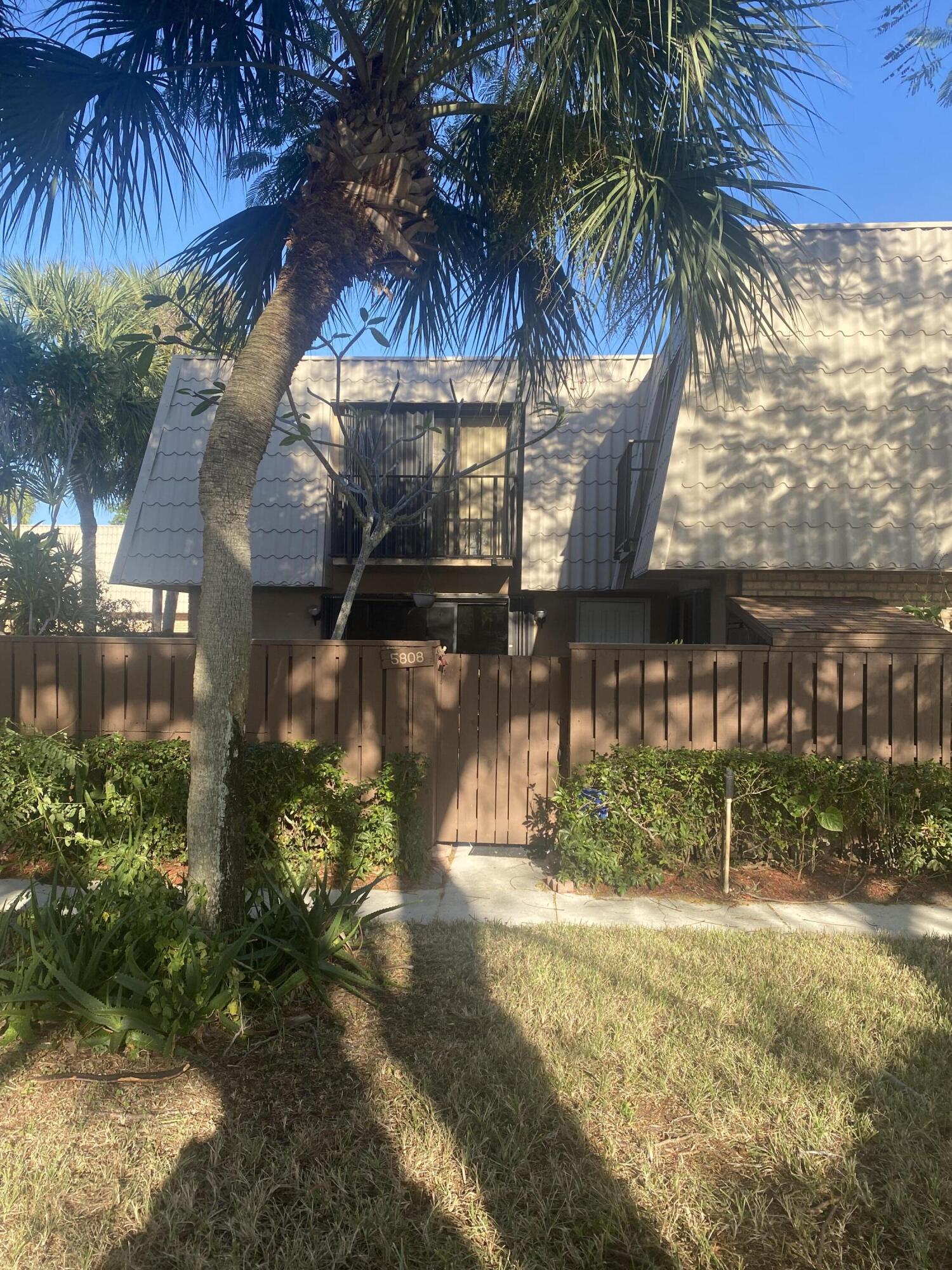 5808 58th Way West Palm Beach, FL 33409 - Photo 2 of 23 a view of outdoor space with garden