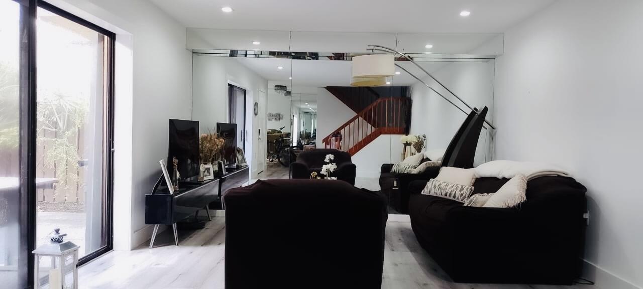 5808 58th Way West Palm Beach, FL 33409 - Photo 4 of 23 a living room with furniture and a flat screen tv