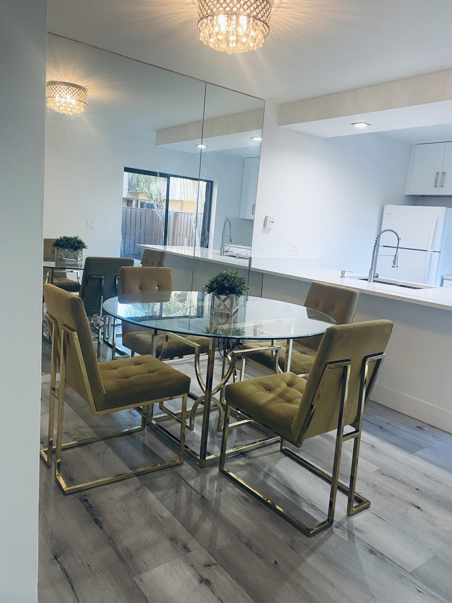5808 58th Way West Palm Beach, FL 33409 - Photo 5 of 23 a view of a dining room with furniture and wooden floor