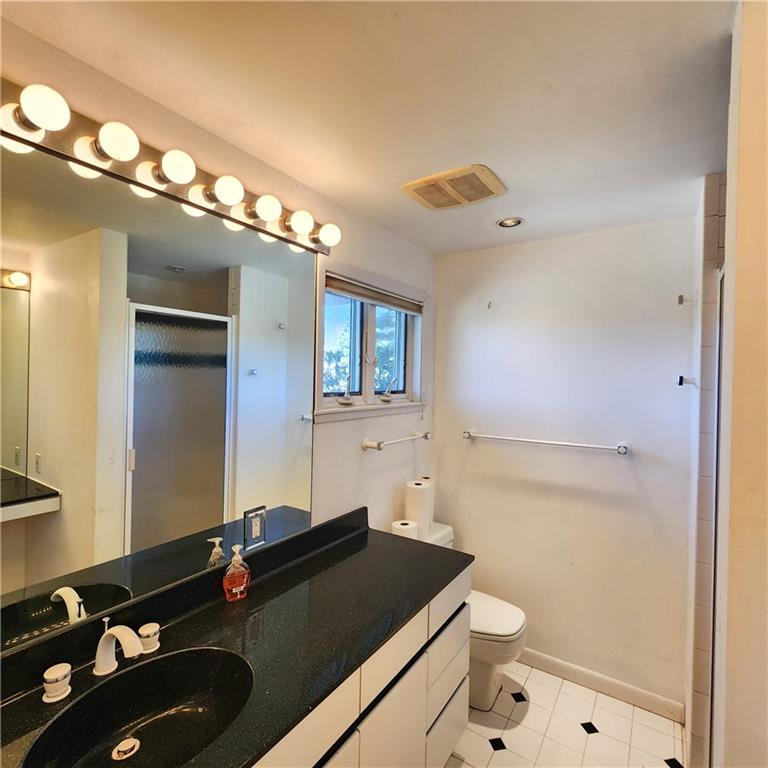 2417 Marbury Road Pittsburgh, PA 15221 - Photo 13 of 31 a bathroom with a sink vanity granite and toilet