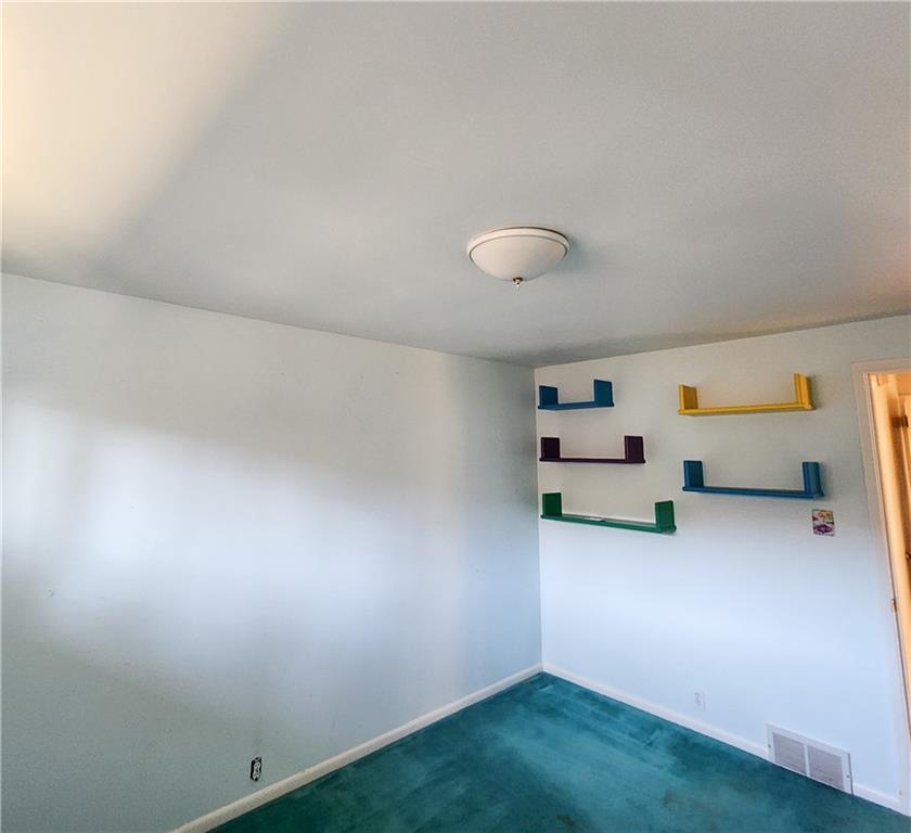 2417 Marbury Road Pittsburgh, PA 15221 - Photo 15 of 31 a view of room and racks on the wall