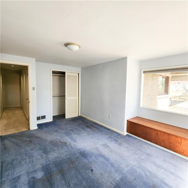 2417 Marbury Road Pittsburgh, PA 15221 - Photo 20 of 31 an empty room with a window and a kitchen