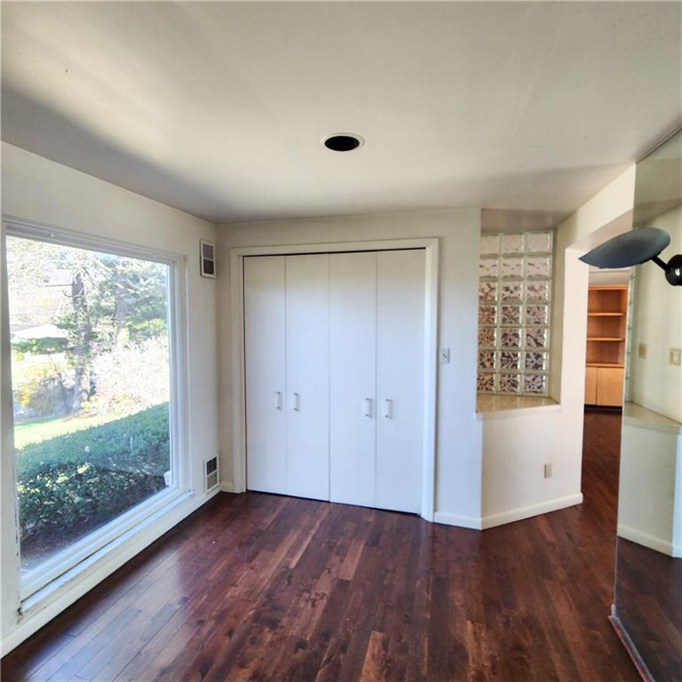 2417 Marbury Road Pittsburgh, PA 15221 - Photo 4 of 31 an empty room with wooden floor and windows