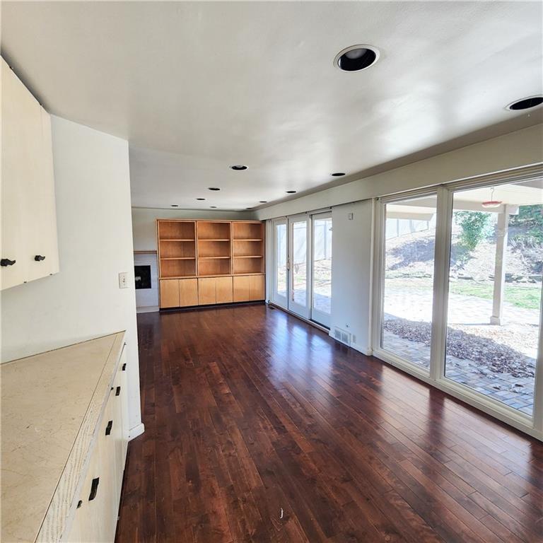 2417 Marbury Road Pittsburgh, PA 15221 - Photo 8 of 31 wooden floor in an empty room with a window