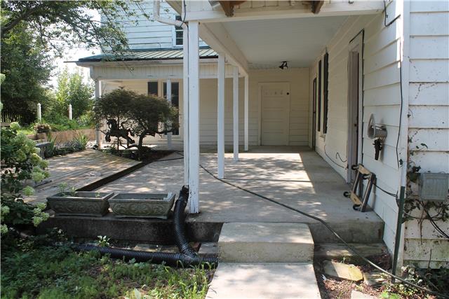 5701 Hickory Ridge Road Lebanon, TN 37090 - Photo 4 of 10 L shaped covered porch entering from carport, 2 patios with gorgeous blooming shrubs