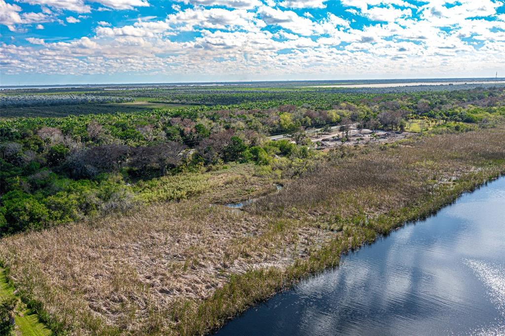 15460 Southwest Conners Highway Okeechobee, FL 34974 - Photo 11 of 28 a view of a yard with an ocean view