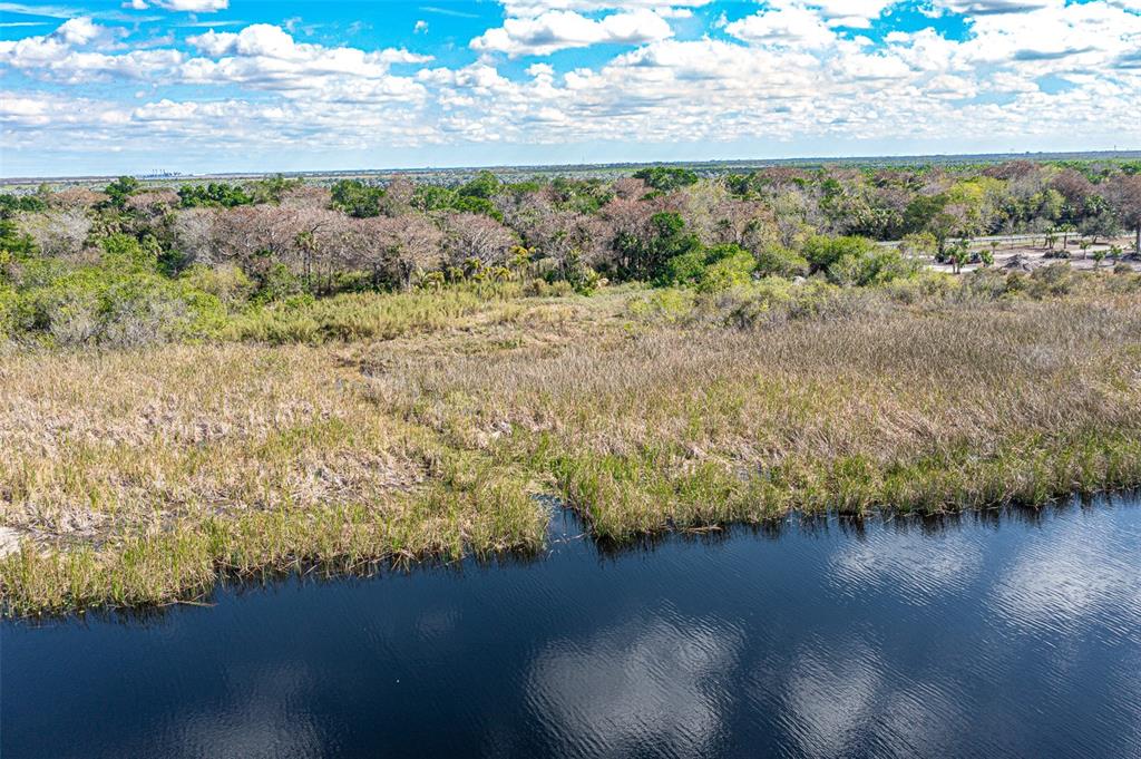 15460 Southwest Conners Highway Okeechobee, FL 34974 - Photo 27 of 28 a view of a yard with wooden floor