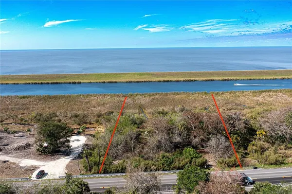 a view of a yard with an ocean view