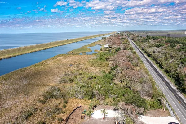 a view of a yard with an ocean view