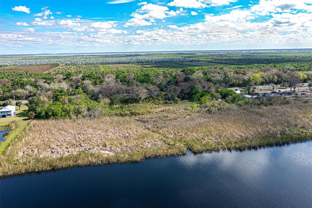 15460 Southwest Conners Highway Okeechobee, FL 34974 - Photo 10 of 28 a view of a lake with a nearby beach