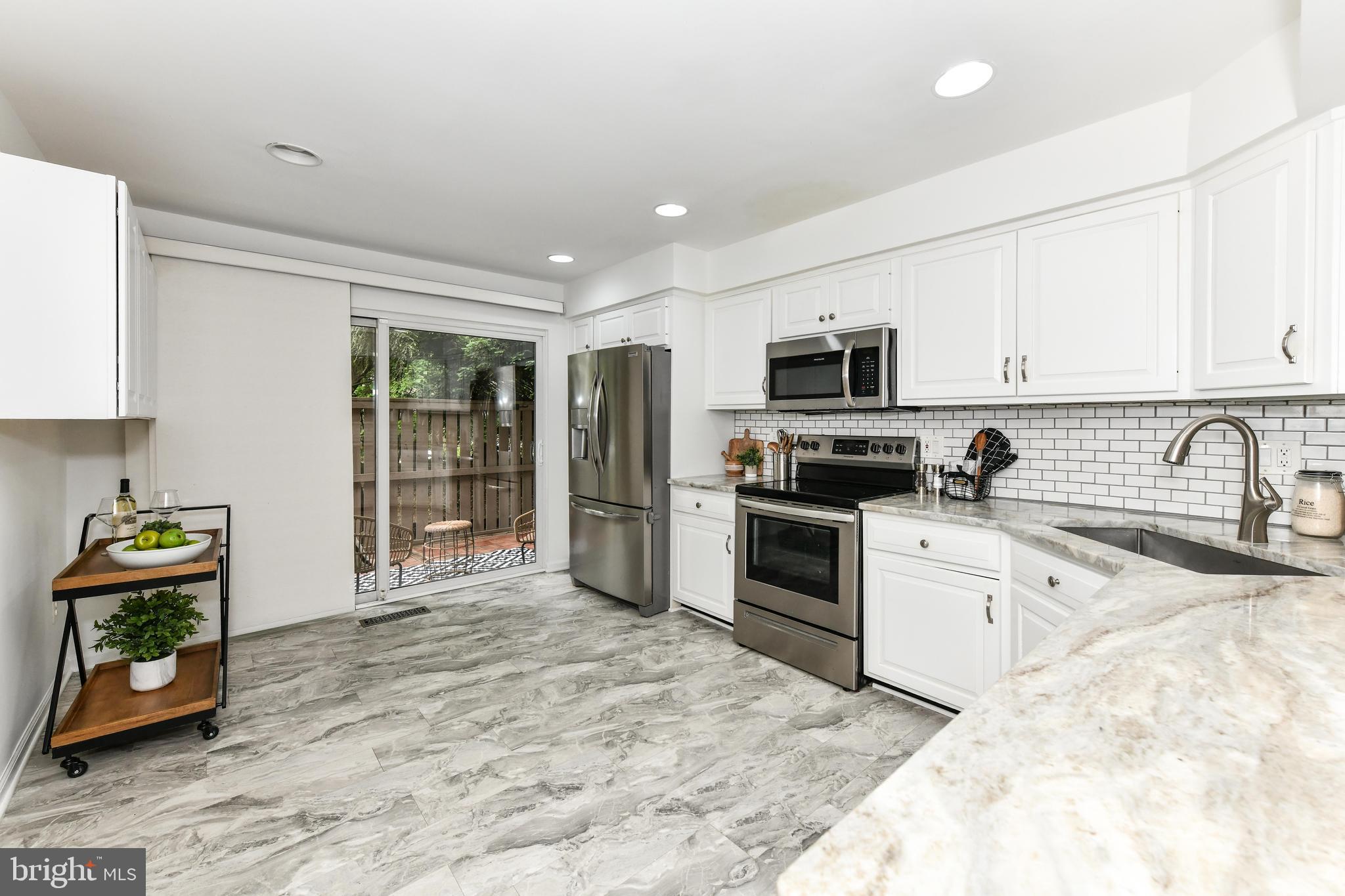 11701 Newbridge Court Reston, VA 20191 - Photo 5 of 64 Beautiful backsplash and tons of cabinets!