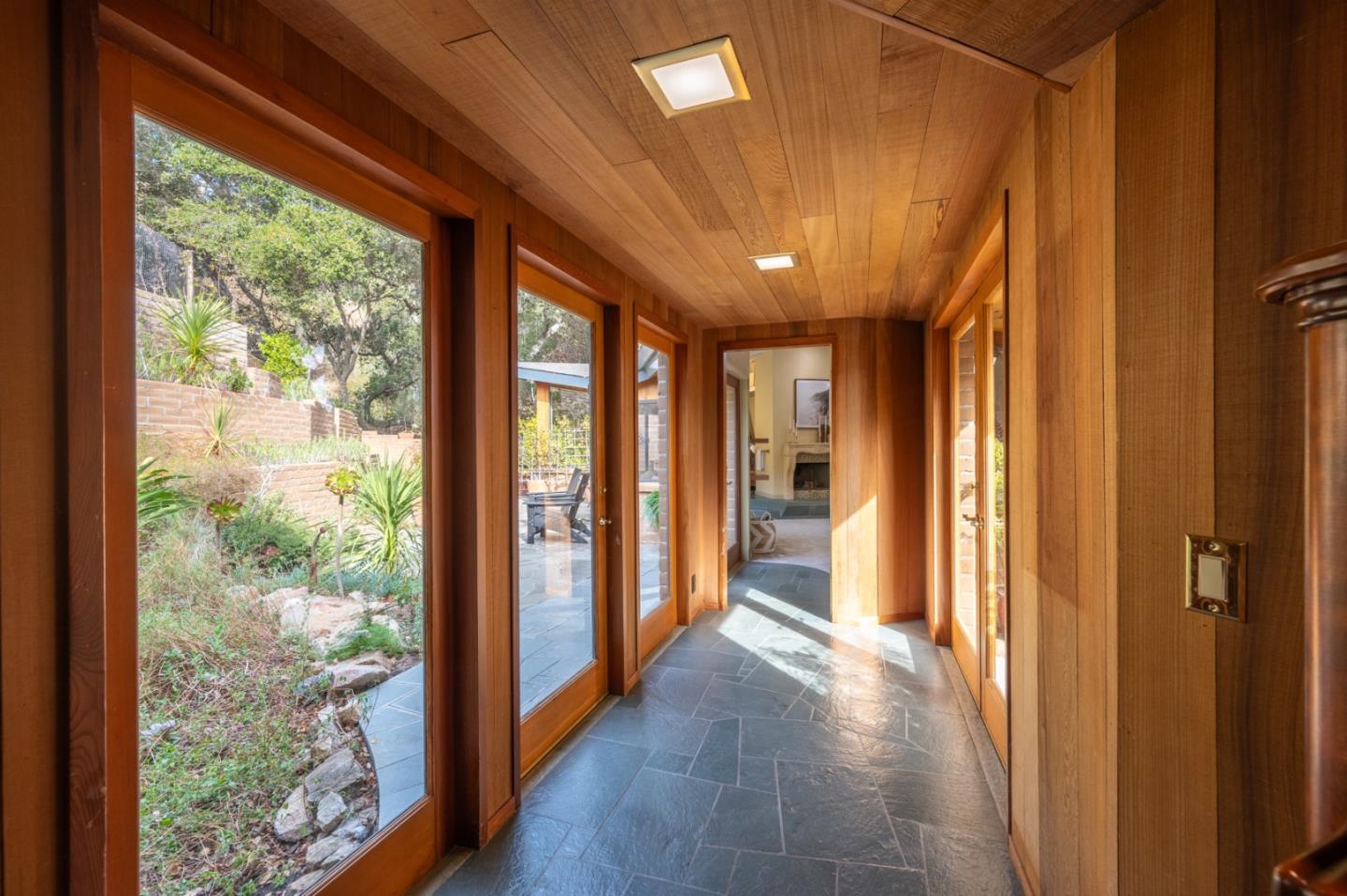 9 Story Road Carmel Valley, CA 93924 - Photo 26 of 60 a view of hallway with a large window and wooden floor