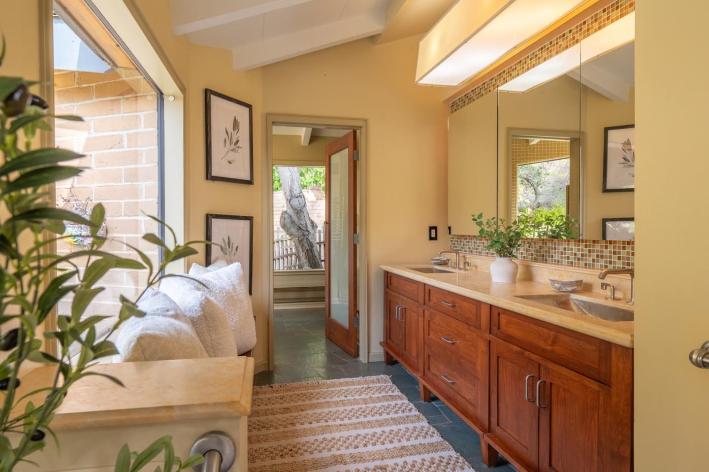 9 Story Road Carmel Valley, CA 93924 - Photo 31 of 60 a spacious bathroom with a double vanity sink and a mirror