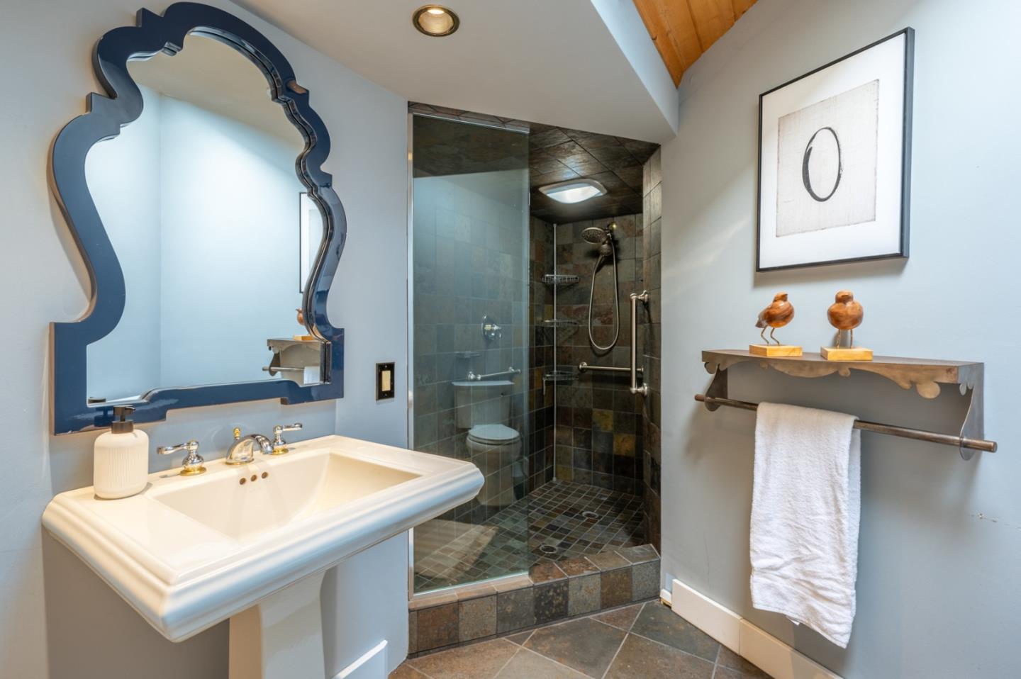 9 Story Road Carmel Valley, CA 93924 - Photo 42 of 60 a bathroom with a sink and mirror