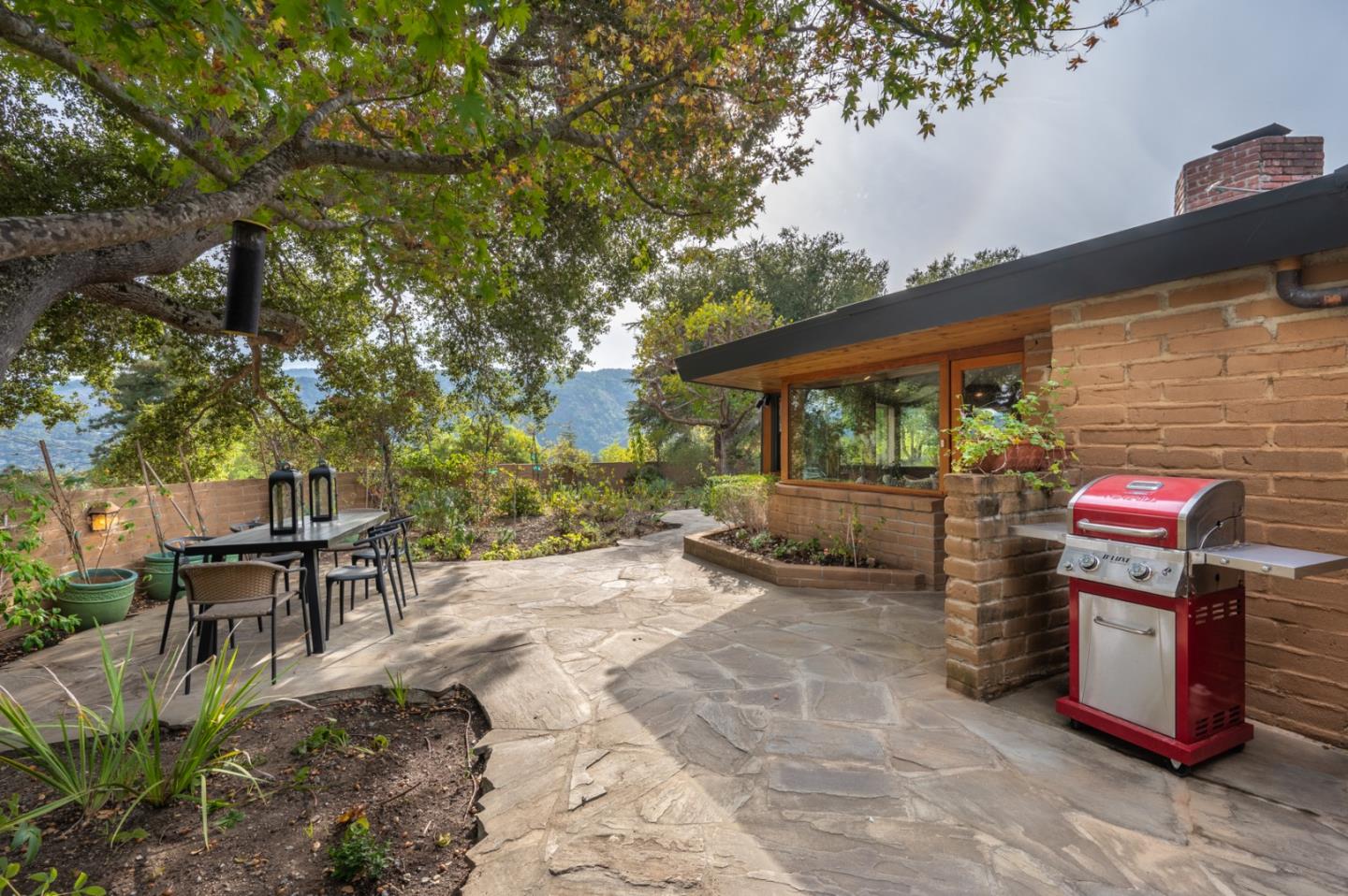 9 Story Road Carmel Valley, CA 93924 - Photo 48 of 60 a view of a chairs and table in the patio