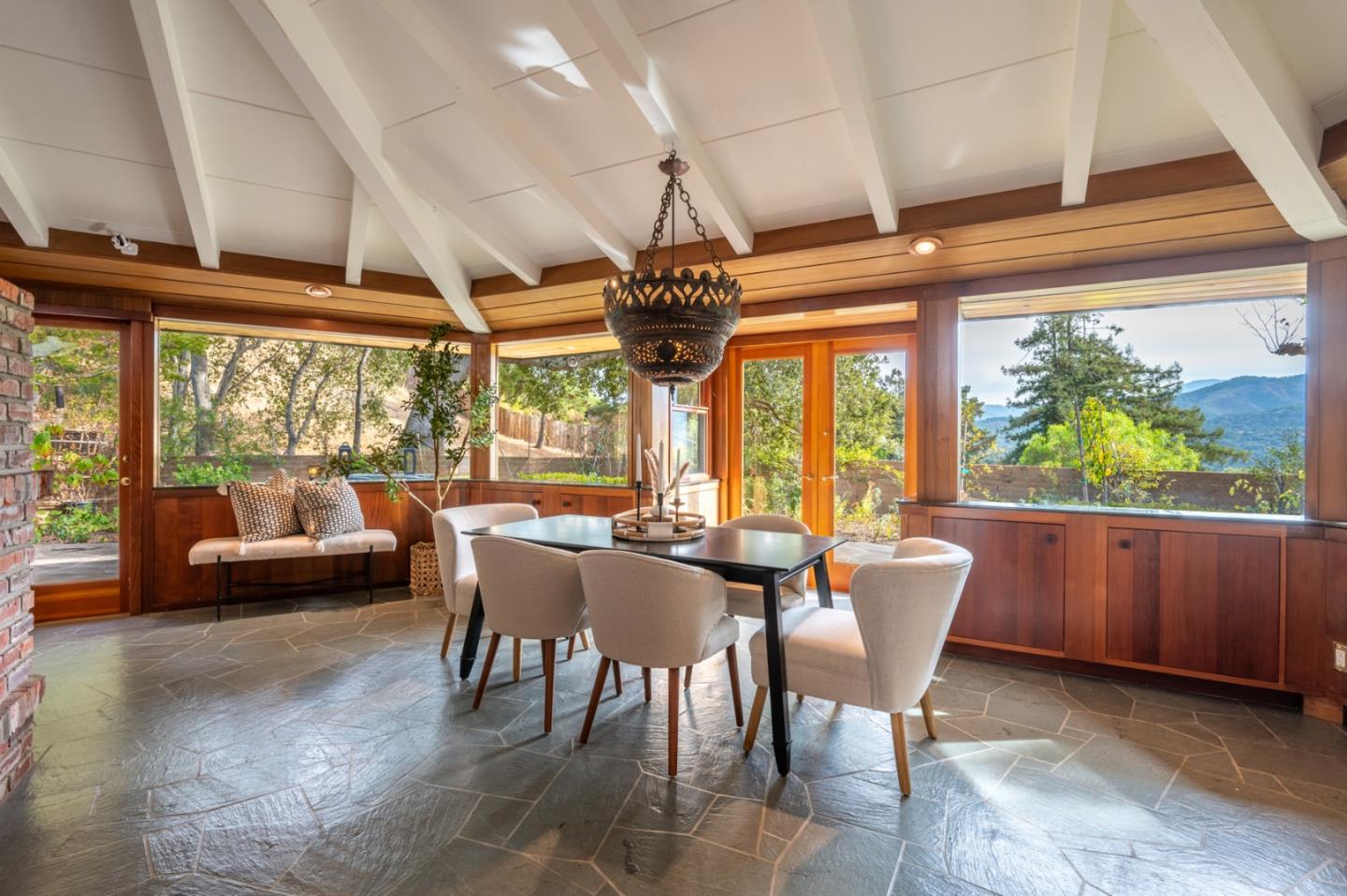 9 Story Road Carmel Valley, CA 93924 - Photo 5 of 60 a view of a dining room with furniture large windows and wooden floor