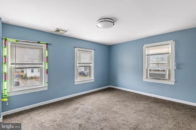 a big room with windows and closet