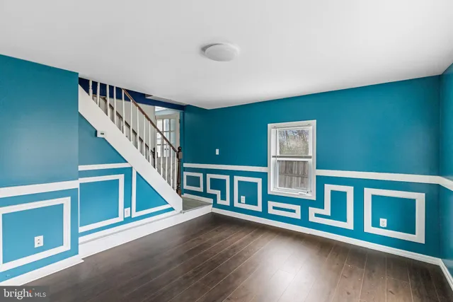a view of an entryway with wooden floor
