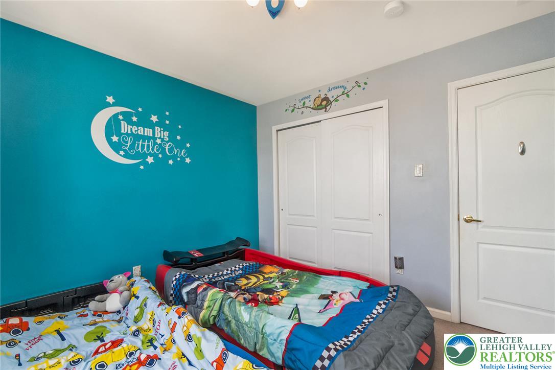 3566 Penfield Way Nazareth, PA 18064 - Photo 36 of 47 A cheerful children's bedroom features bright walls and ample storage with convenient closet access.