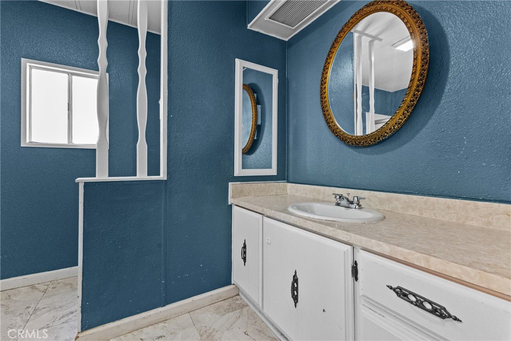 38942 Jubilee Way Fallbrook, CA 92028 - Photo 14 of 55 a bathroom with a sink and a mirror