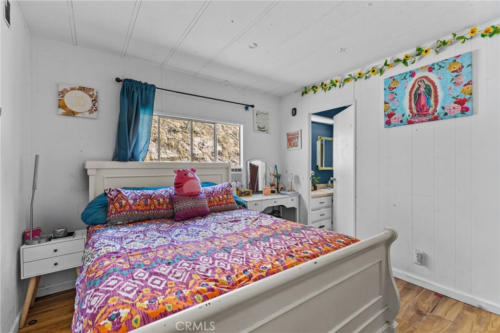 38942 Jubilee Way Fallbrook, CA 92028 - Photo 16 of 55 a bedroom with a large bed and a window