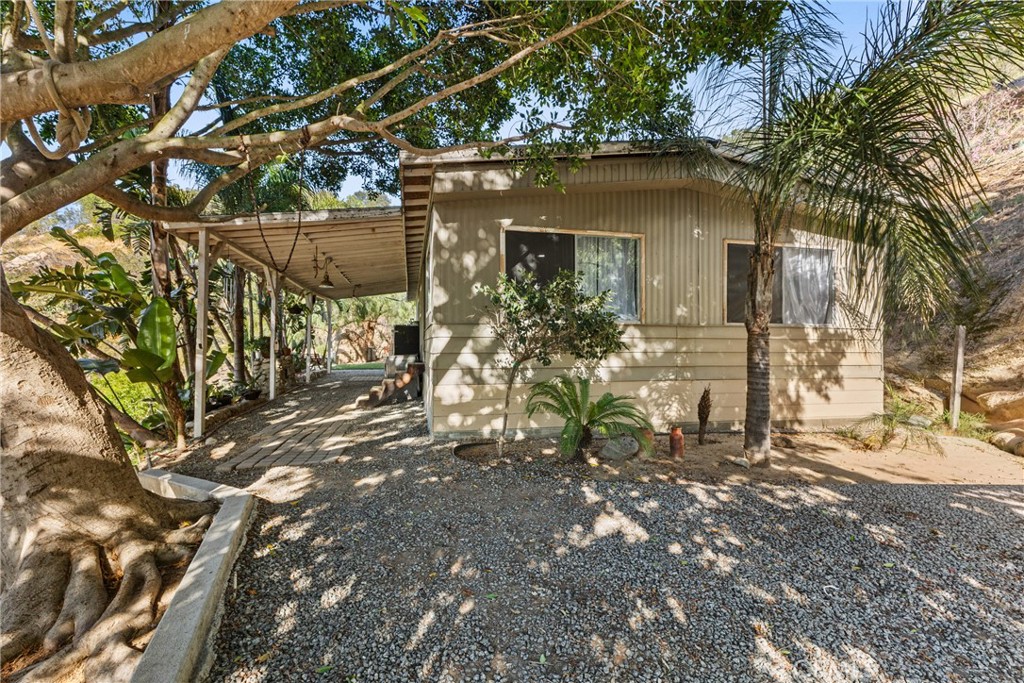 38942 Jubilee Way Fallbrook, CA 92028 - Photo 22 of 55 a front view of a house with a tree
