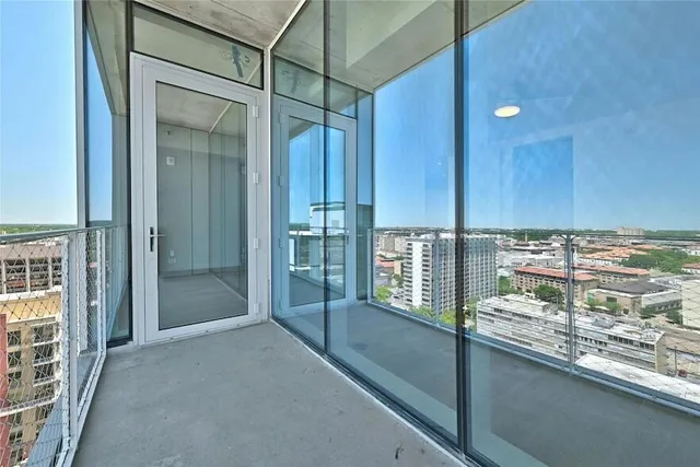 a view of a bathroom with a shower and a sink