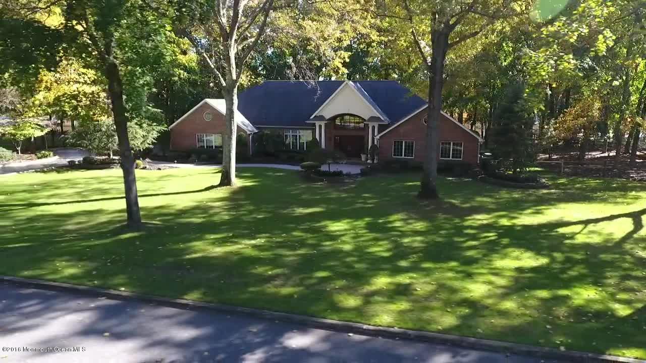 31 Beaver Dam Road Colts Neck, NJ 07722 - Photo 2 of 54 a backyard of a house with table and chairs