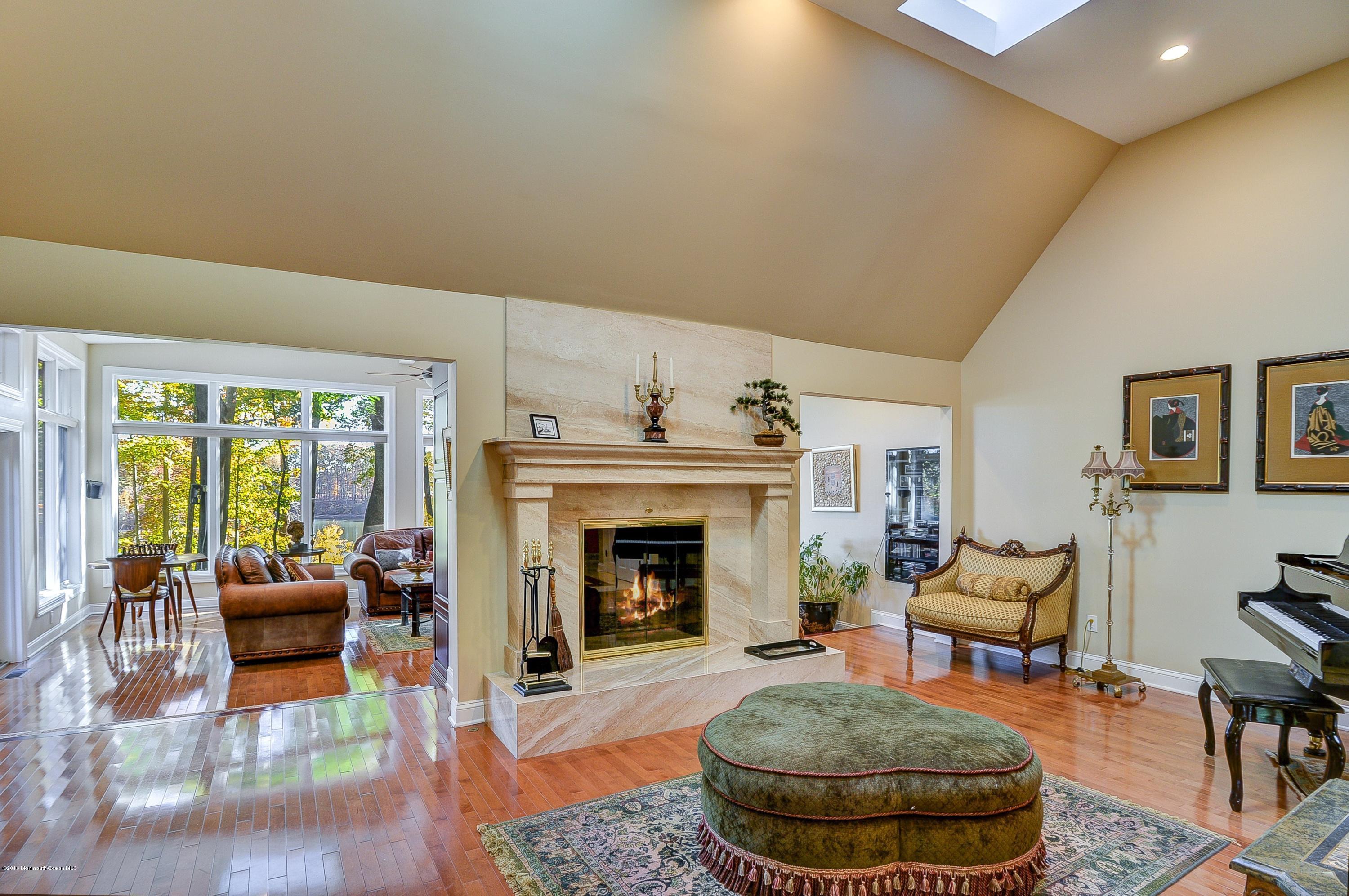 31 Beaver Dam Road Colts Neck, NJ 07722 - Photo 13 of 54 a living room with furniture and a fireplace