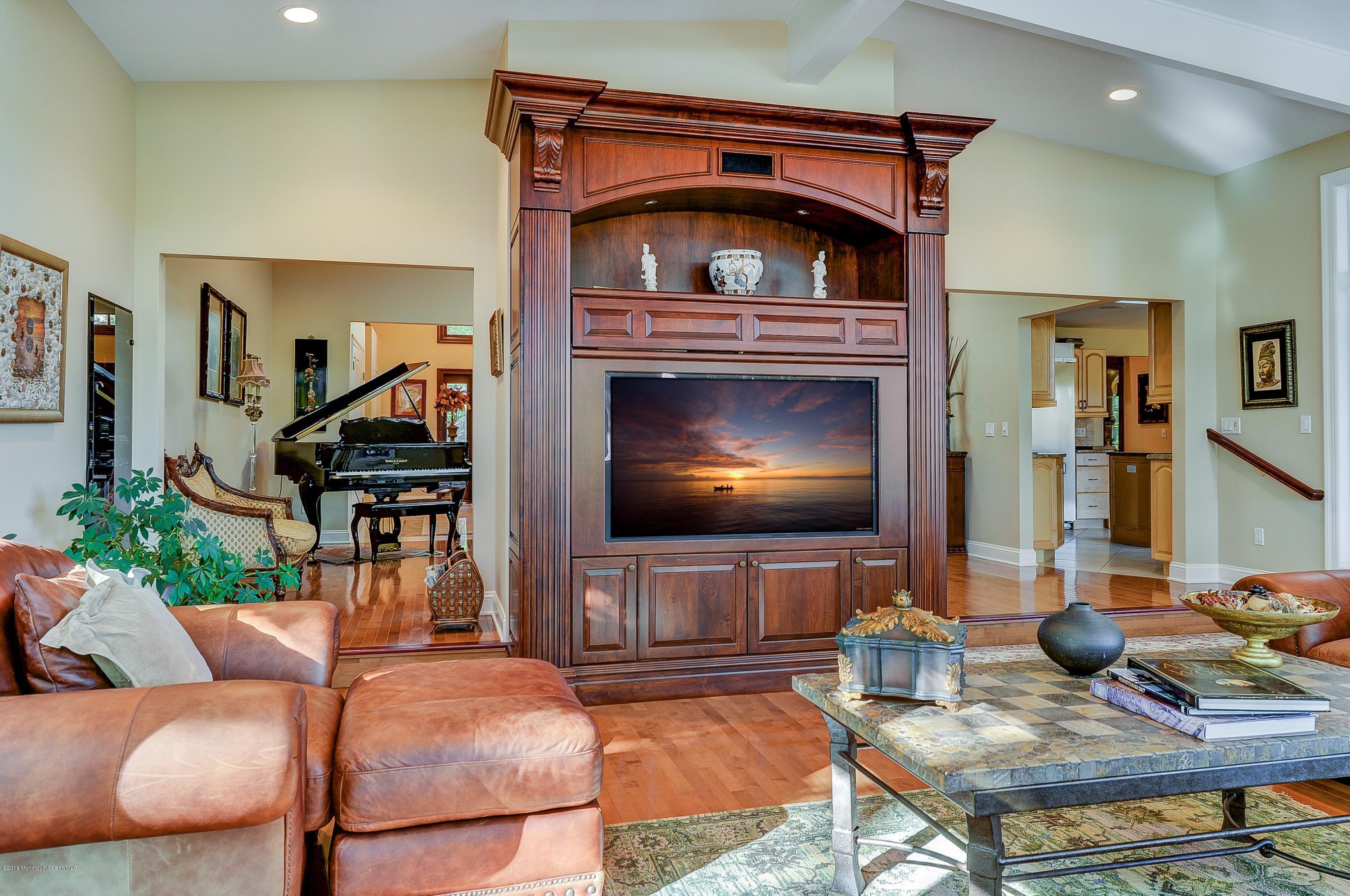 31 Beaver Dam Road Colts Neck, NJ 07722 - Photo 18 of 54 a living room with furniture and a flat screen tv