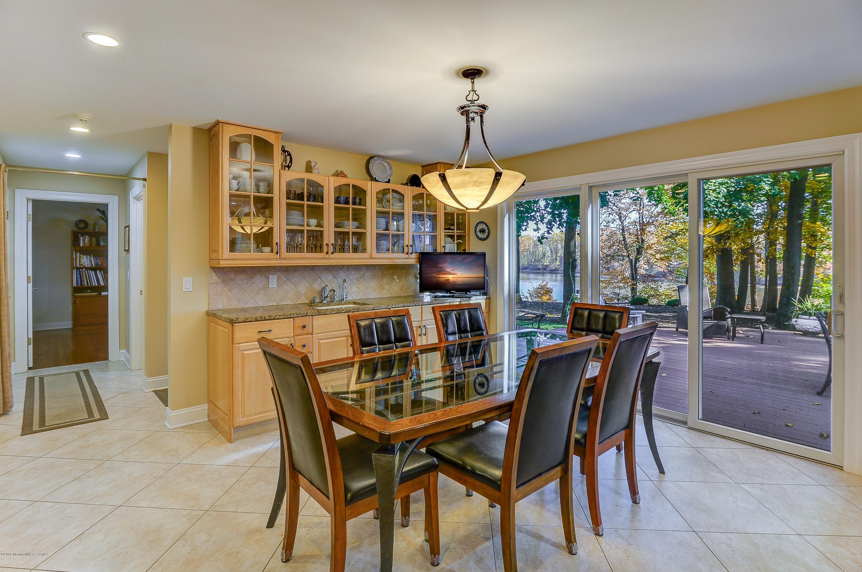31 Beaver Dam Road Colts Neck, NJ 07722 - Photo 20 of 54 a view of a dining room with furniture window and outside view