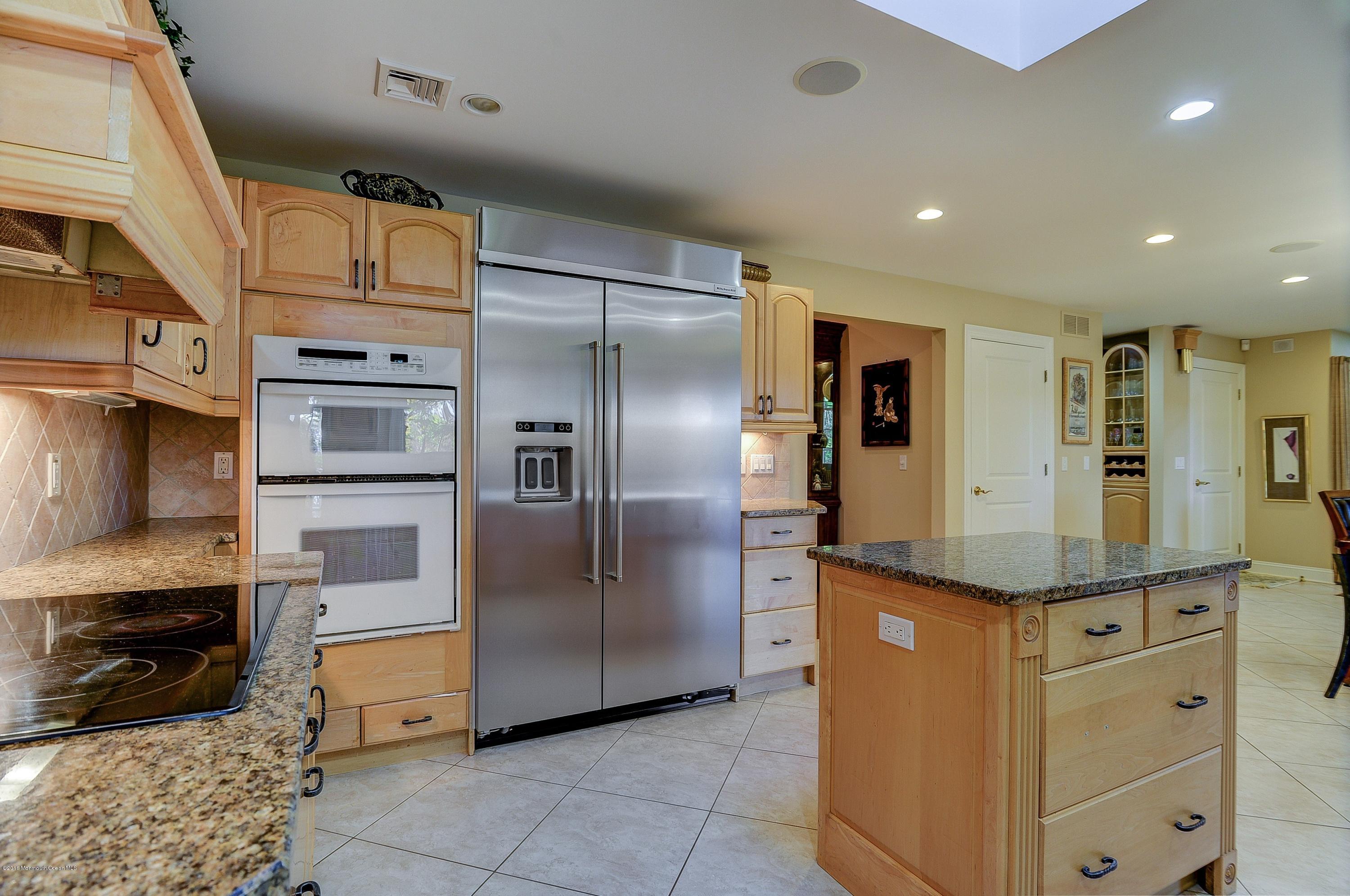 31 Beaver Dam Road Colts Neck, NJ 07722 - Photo 22 of 54 a kitchen with stainless steel appliances granite countertop a refrigerator a oven and a sink